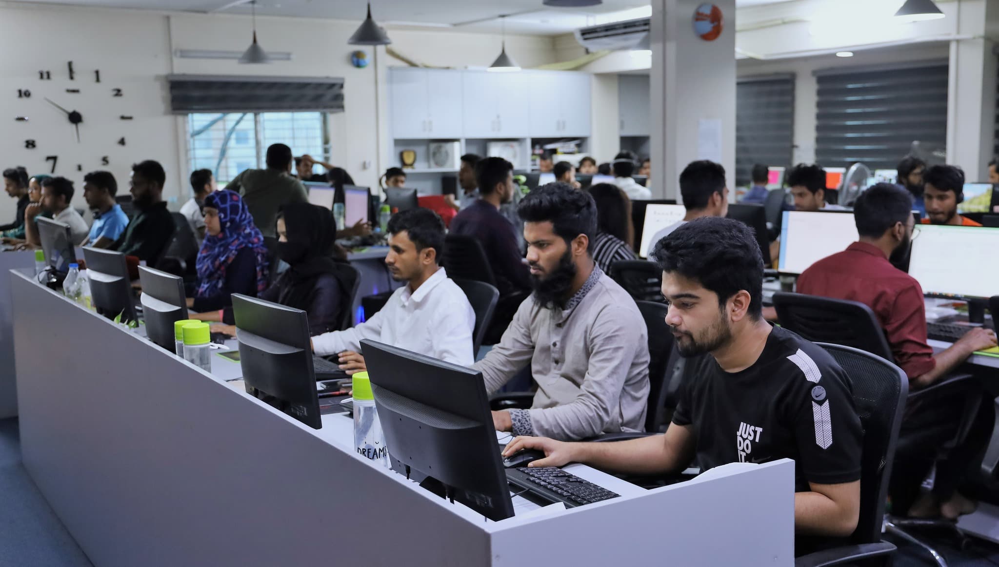 Employees working on global tech projects